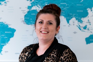 Emma in front of the office map.