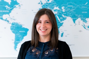 Jess in front of the office map.