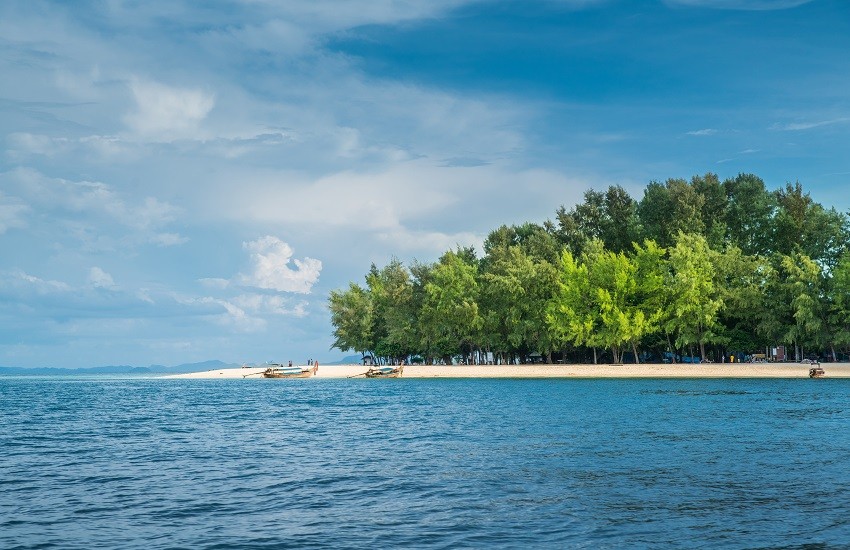 View of Ko Phai Bamboo Island from the sea with blue sky