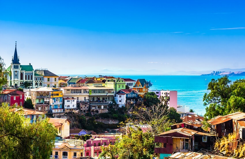 Valparaíso in Chile with colourful hillside buildings and a blue sea backdrop