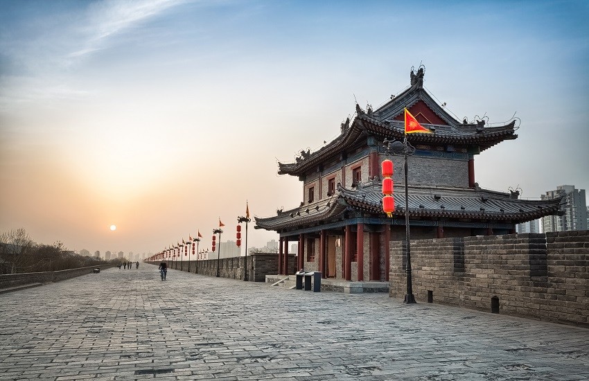 Xi’an city wall and ancient tower at dusk, with soft evening light